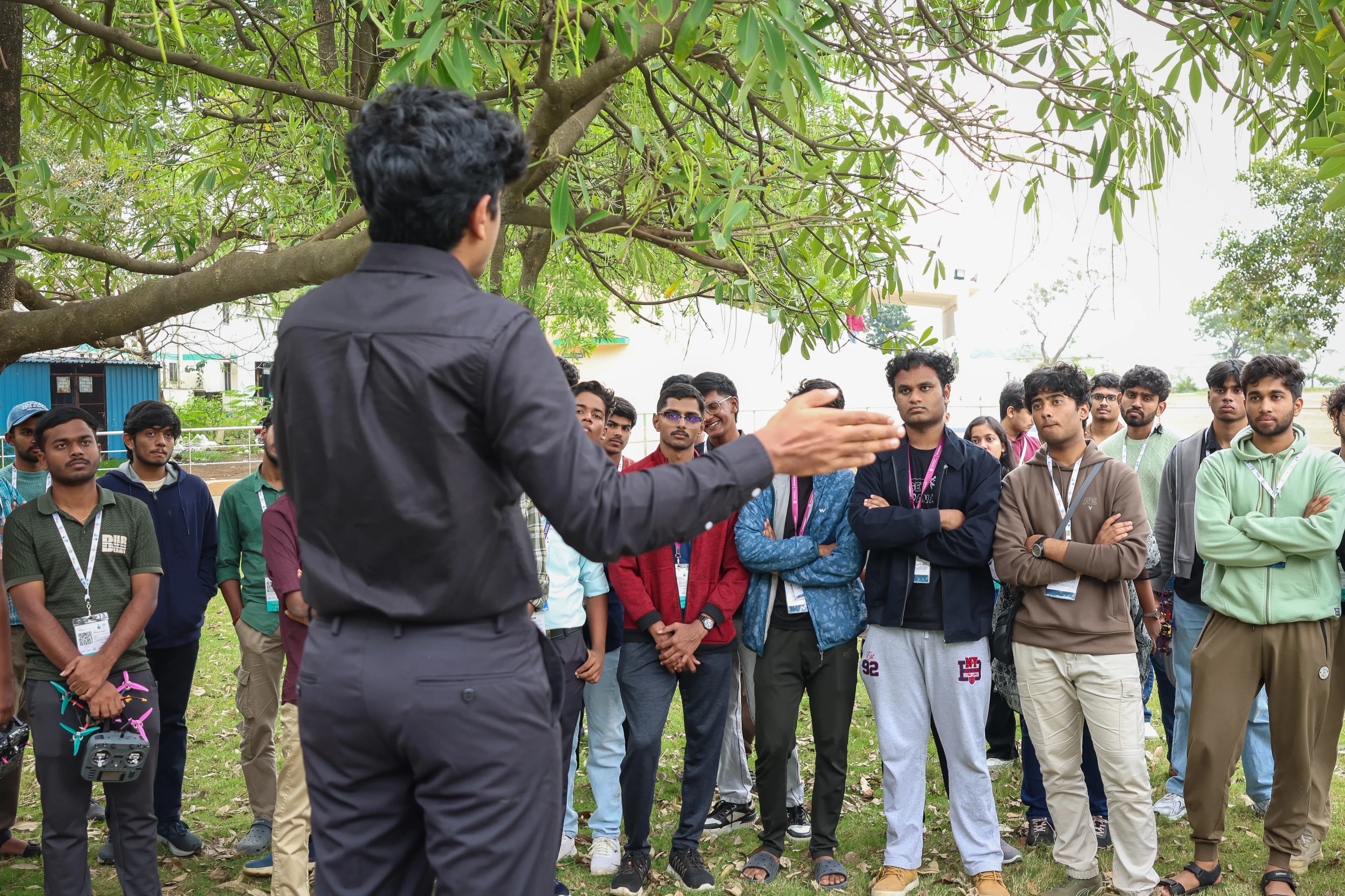 QuantumSlate founder addressing a group of engineering students outdoors